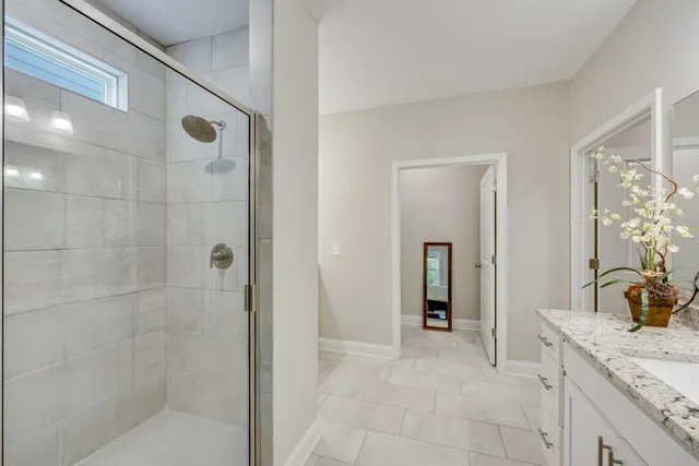 a room with pool table and windows