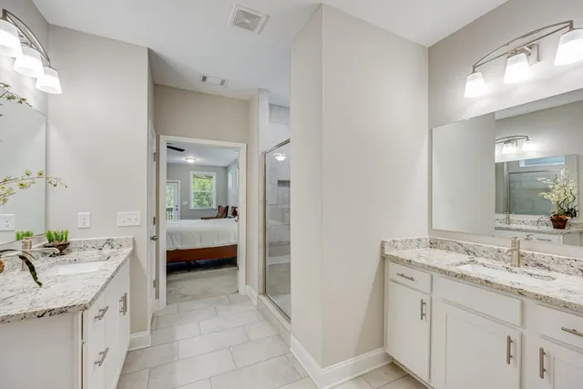 a kitchen with stainless steel appliances a refrigerator sink and cabinets
