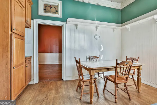 a view of an empty room with a staircase