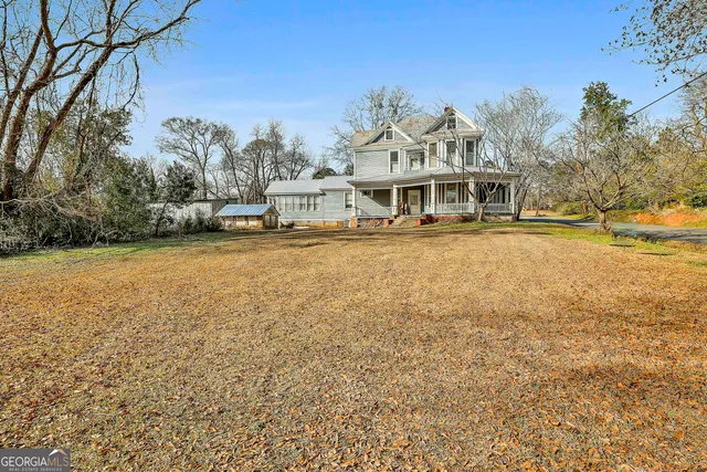 a kitchen with stainless steel appliances granite countertop a sink and wooden cabinets