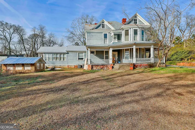 a outdoor dining space with furniture and a potted plant