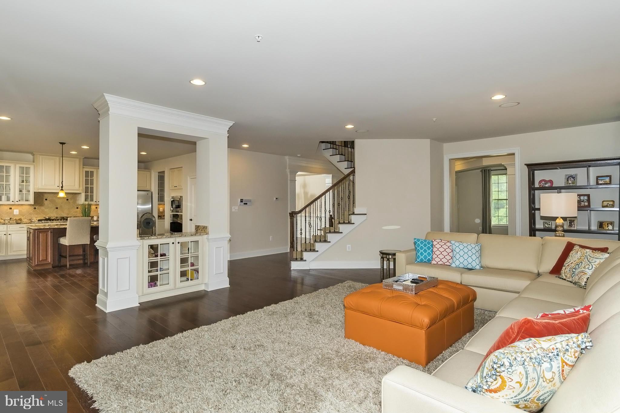 7733 Elmwood Road Fulton, MD 20759 - Photo 11 of 30 a living room with furniture and a wooden floor
