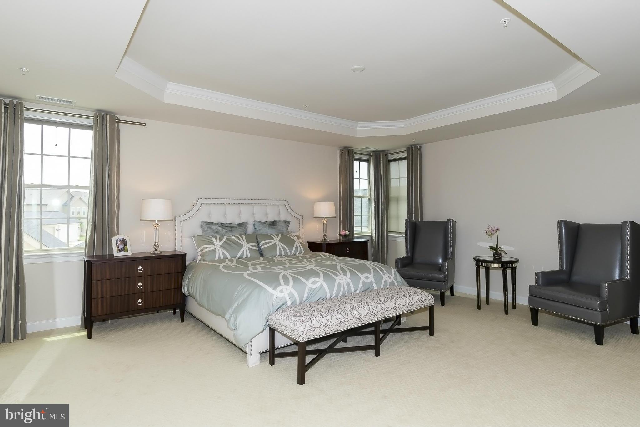 7733 Elmwood Road Fulton, MD 20759 - Photo 14 of 30 a bedroom with a bed and a table chair