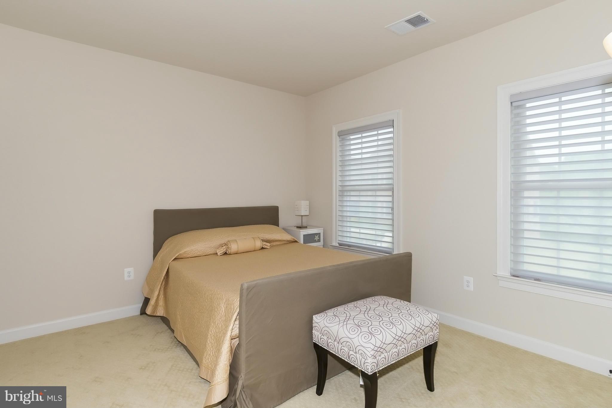 7733 Elmwood Road Fulton, MD 20759 - Photo 20 of 30 a bedroom with a bed and a dresser