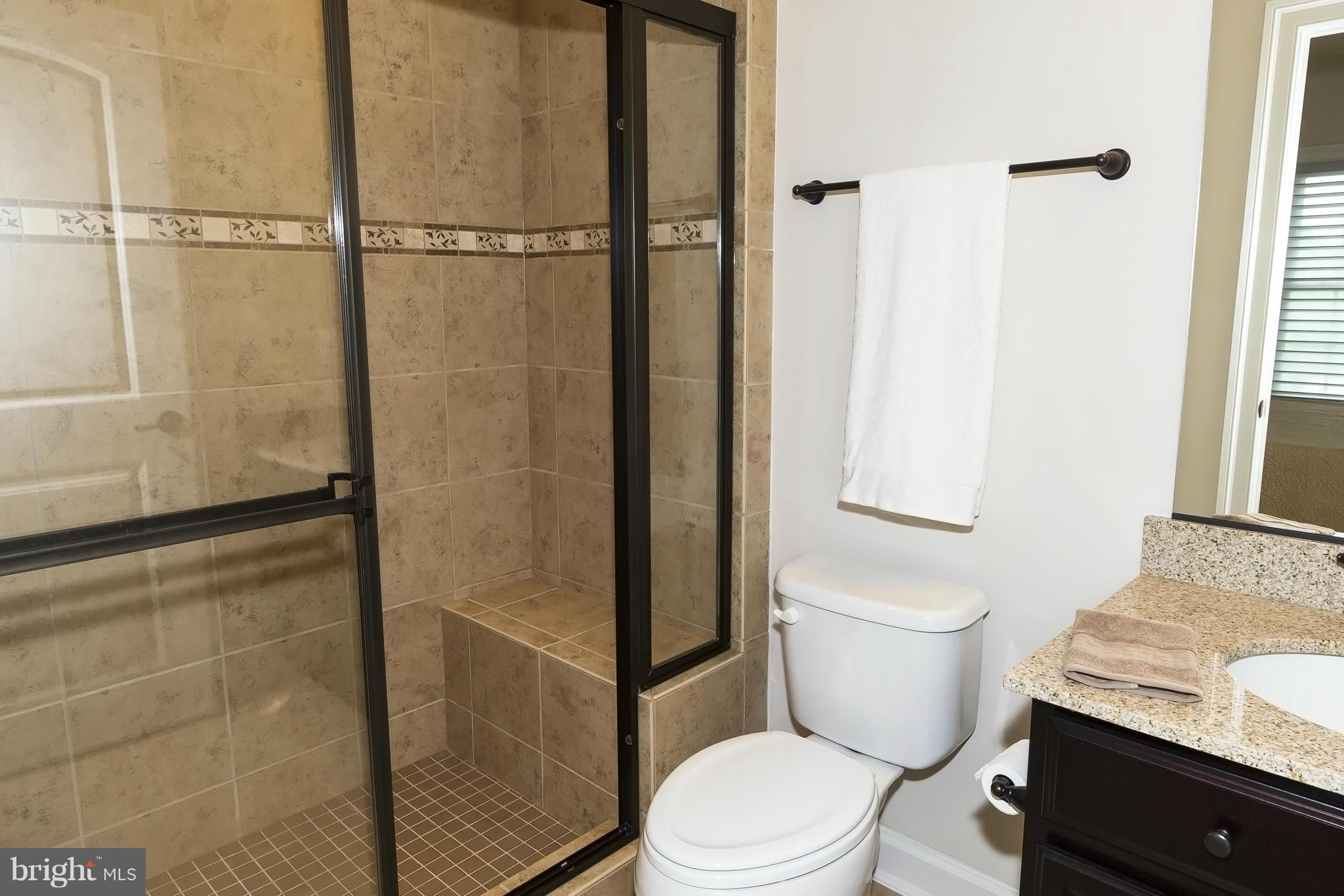7733 Elmwood Road Fulton, MD 20759 - Photo 21 of 30 a white toilet sitting next to a bathroom sink