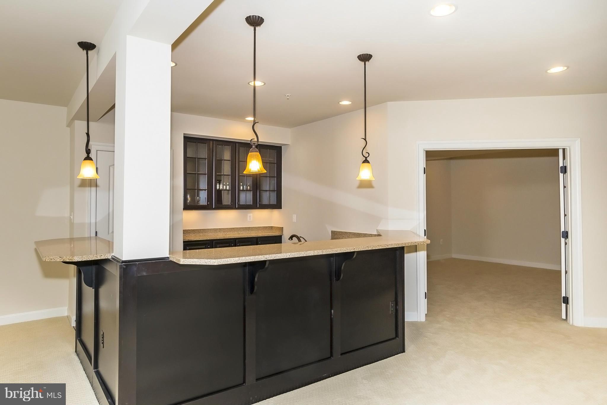 7733 Elmwood Road Fulton, MD 20759 - Photo 25 of 30 a view of a kitchen with a sink and refrigerator