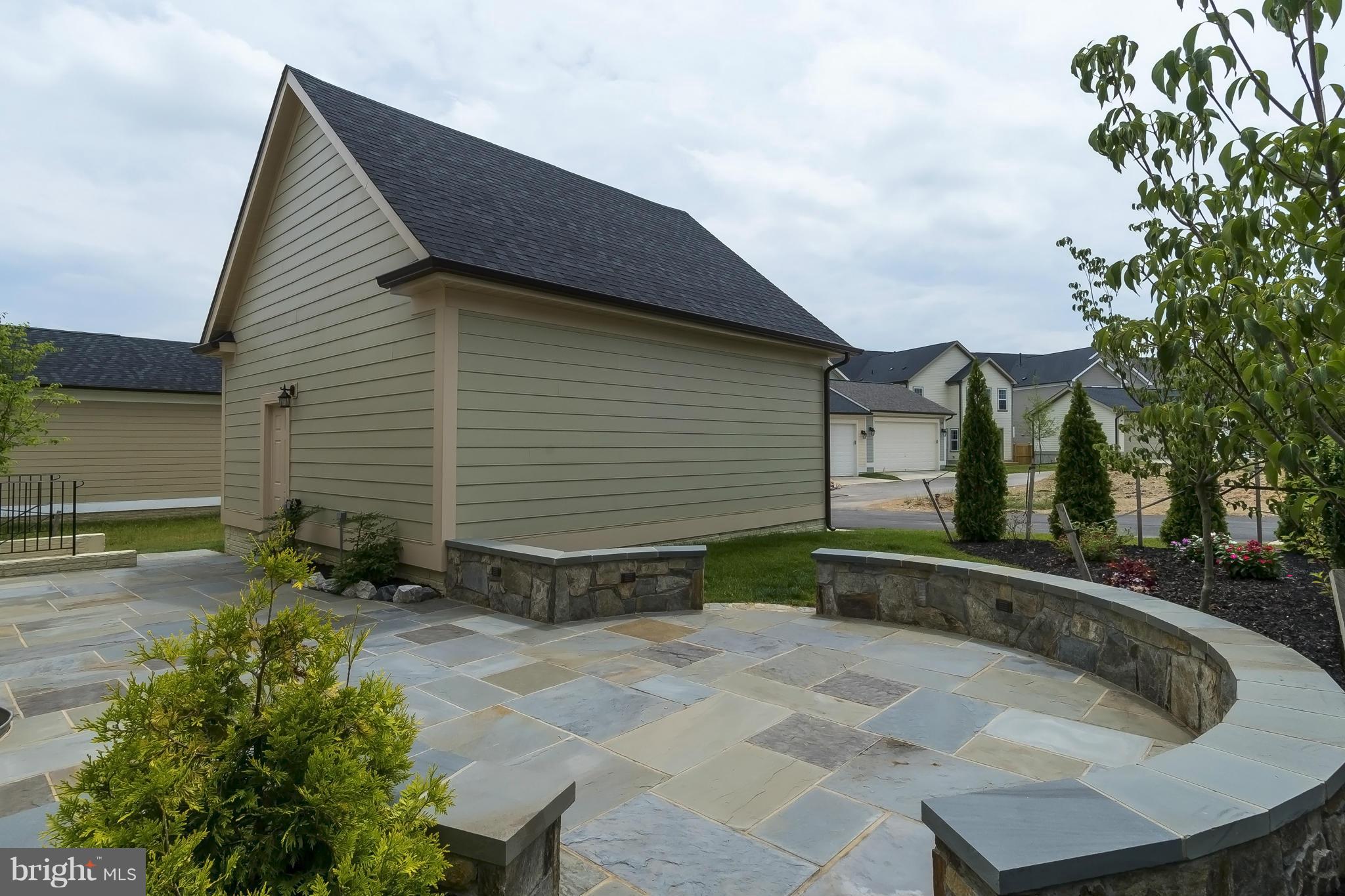 7733 Elmwood Road Fulton, MD 20759 - Photo 28 of 30 a backyard of a house with yard and outdoor seating