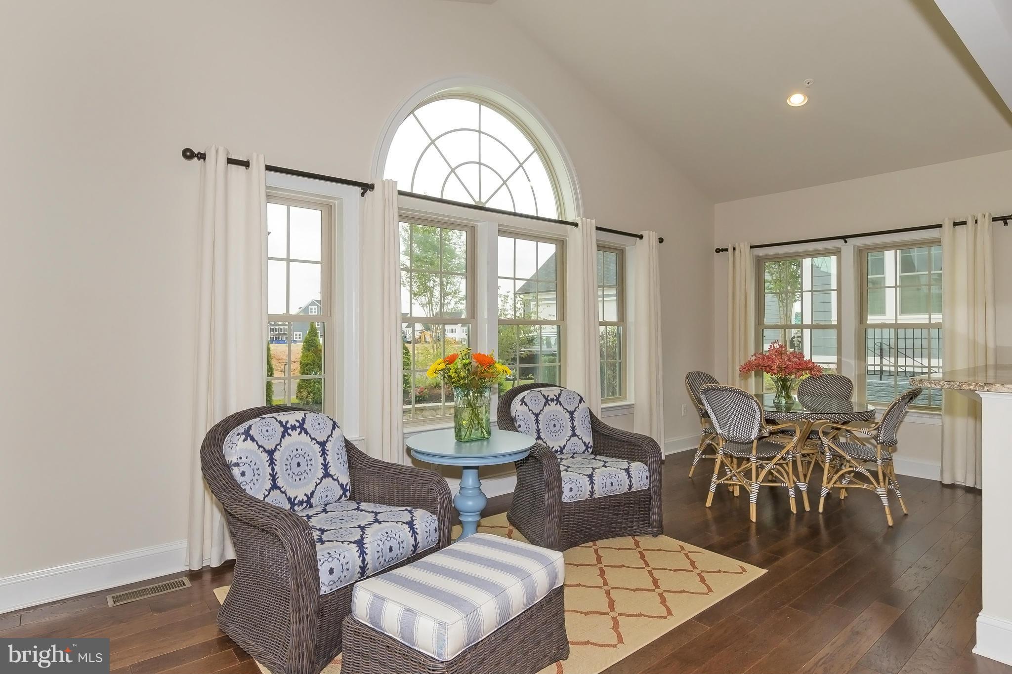 7733 Elmwood Road Fulton, MD 20759 - Photo 4 of 30 a living room with furniture a table and chairs
