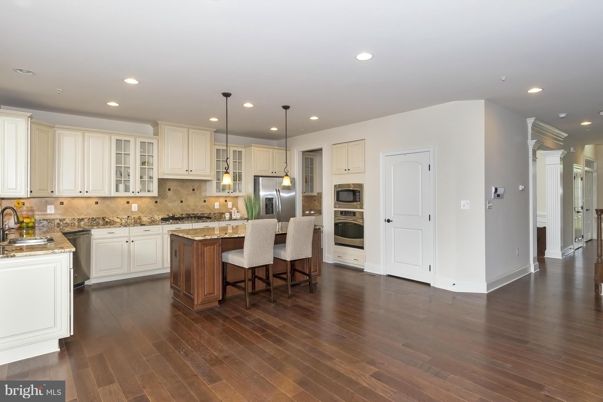 7733 Elmwood Road Fulton, MD 20759 - Photo 6 of 30 a kitchen with a sink and wooden floor