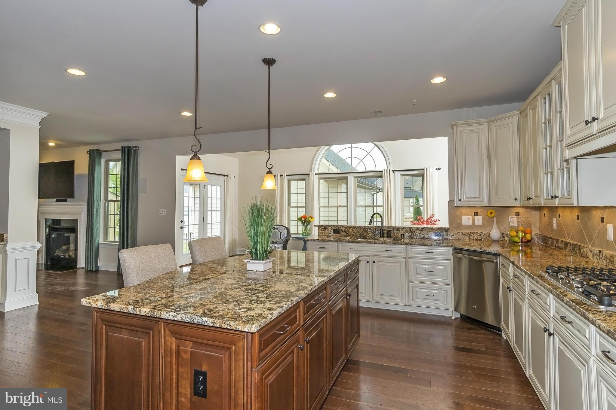 7733 Elmwood Road Fulton, MD 20759 - Photo 7 of 30 a kitchen with stainless steel appliances granite countertop stove top oven and refrigerator