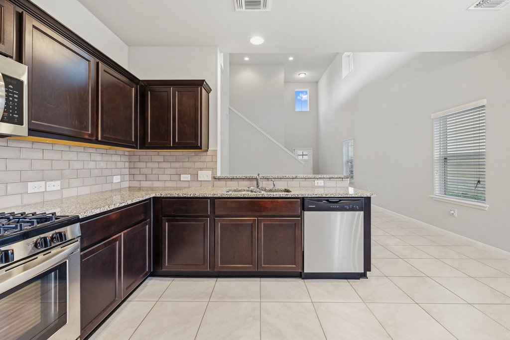 6517 Ranchito Drive Austin, TX 78744 - Photo 14 of 36 Bright dining area with views into the main living space