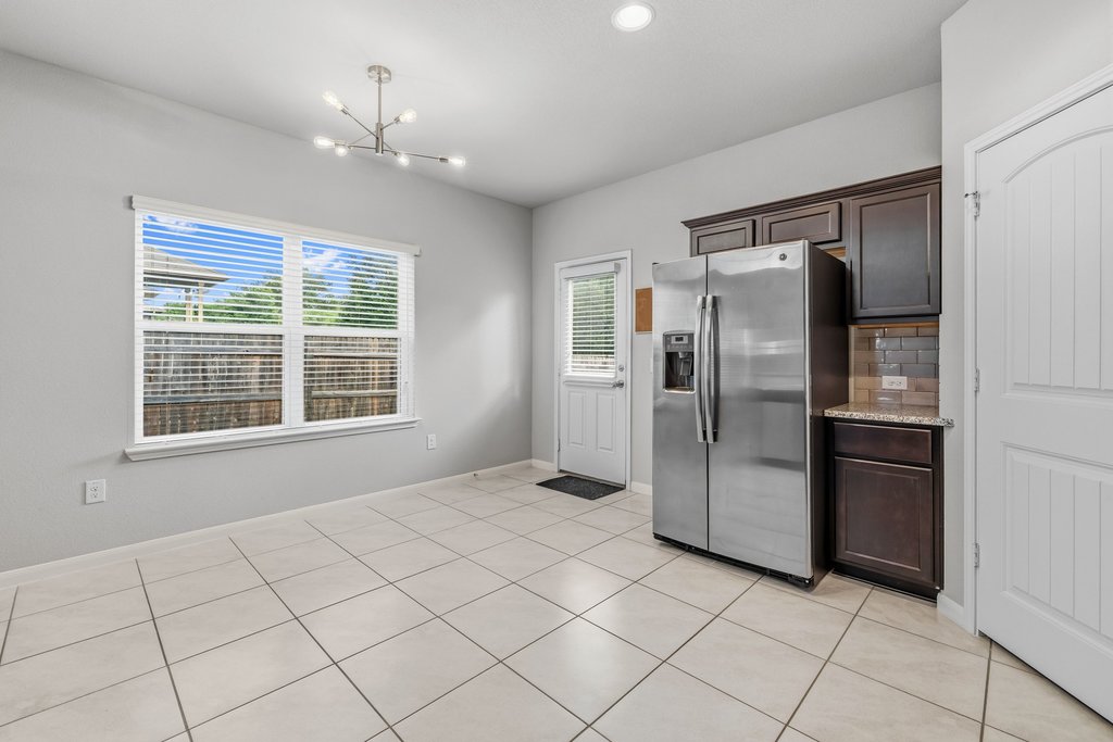 6517 Ranchito Drive Austin, TX 78744 - Photo 16 of 36 Dining space positioned between the kitchen and with access to backyard