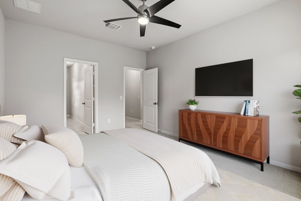 6517 Ranchito Drive Austin, TX 78744 - Photo 17 of 36 Primary bedroom with comfortable layout and generous space (image may be virtually staged)