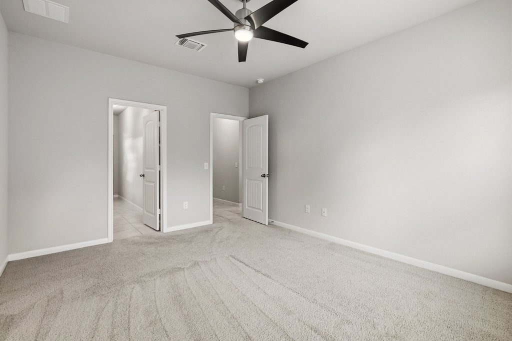 6517 Ranchito Drive Austin, TX 78744 - Photo 18 of 36 Primary bedroom with comfortable layout and generous space