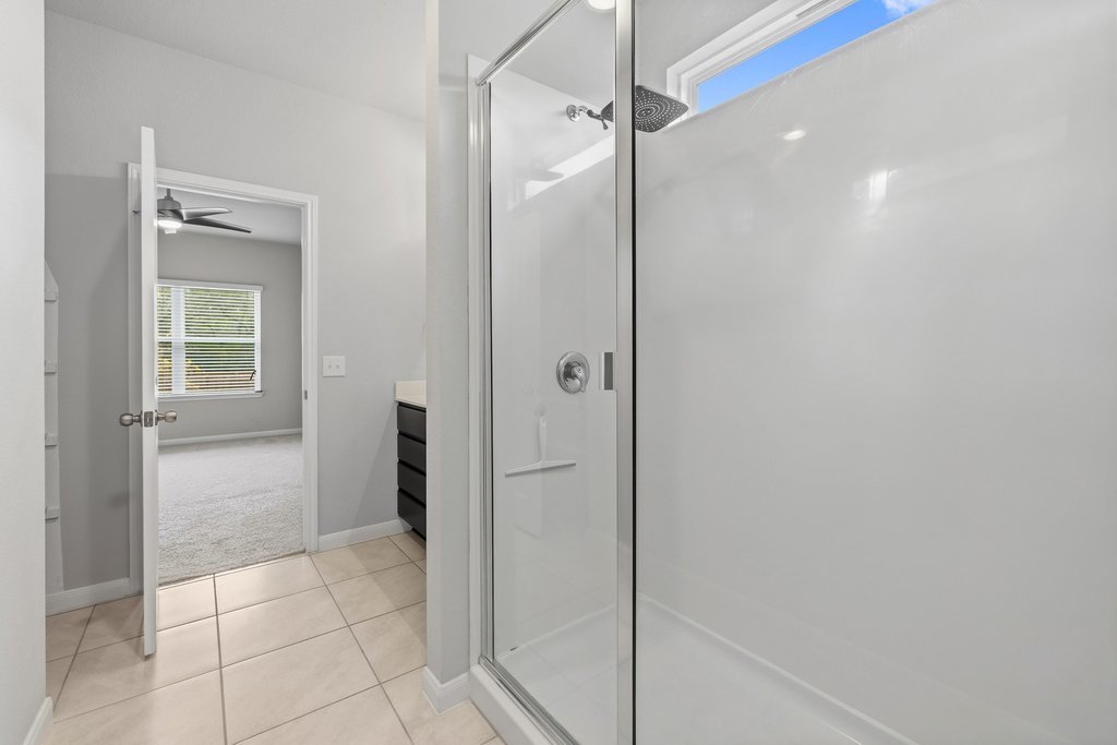 6517 Ranchito Drive Austin, TX 78744 - Photo 20 of 36 Walk-in Shower with natural lighting and plenty of privacy