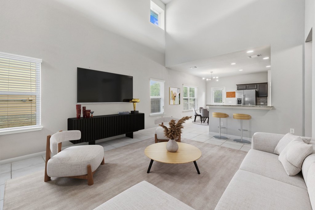 6517 Ranchito Drive Austin, TX 78744 - Photo 2 of 36 Spacious living area with high ceilings and abundant natural light (image may be virtually staged)