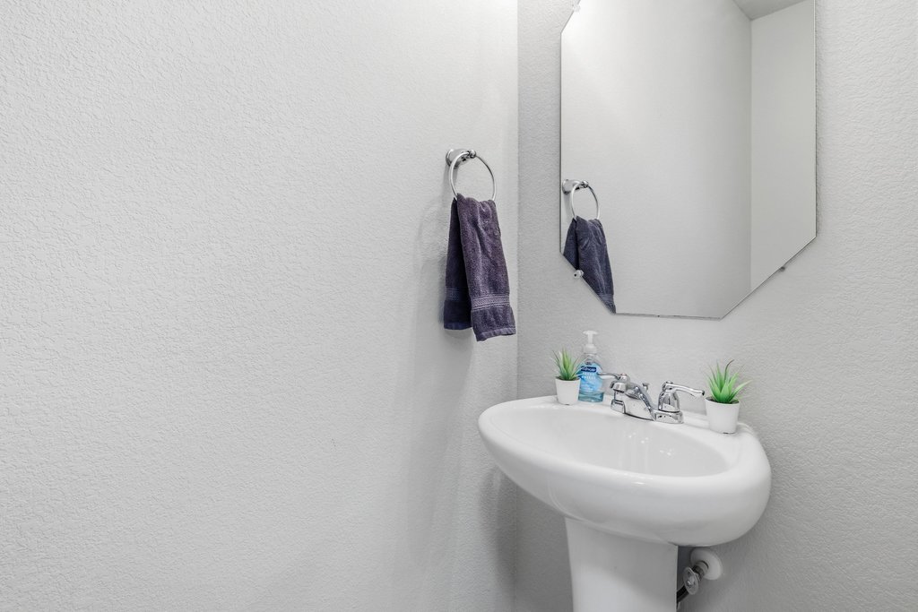 6517 Ranchito Drive Austin, TX 78744 - Photo 31 of 36 Half bath conveniently located downstairs for guests