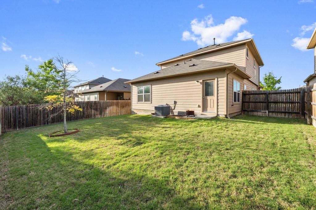 6517 Ranchito Drive Austin, TX 78744 - Photo 35 of 36 Gently sloped yard providing character and functional outdoor space