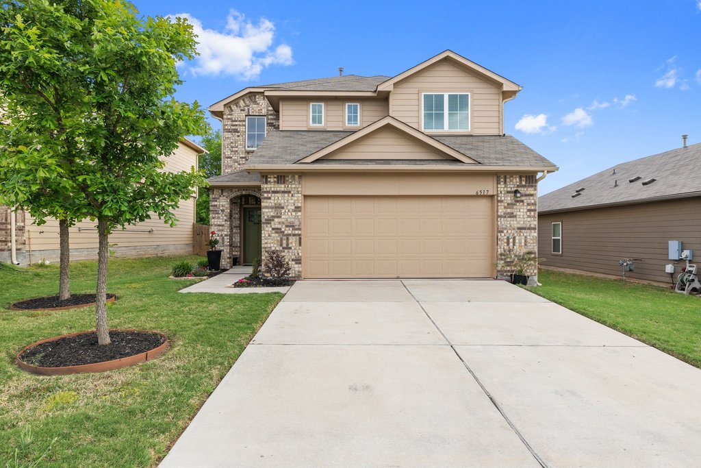6517 Ranchito Drive Austin, TX 78744 - Photo 4 of 36 Front exterior with with a stylish neutral brick façade & refreshed landscaping