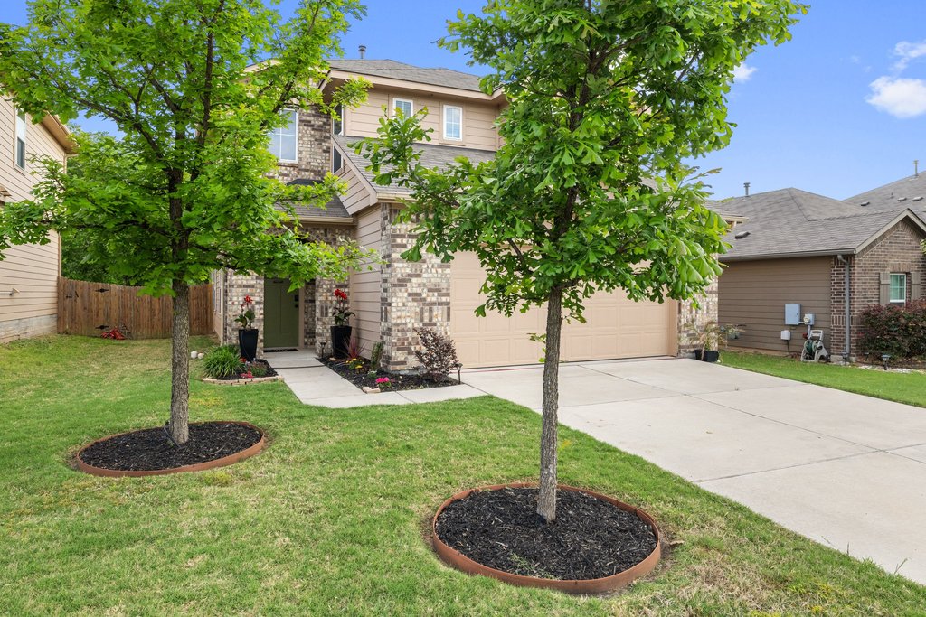 6517 Ranchito Drive Austin, TX 78744 - Photo 5 of 36 Front exterior with inviting curb appeal and lush trees