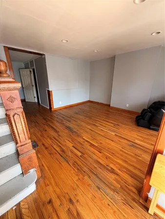 a bedroom with a bed and a mirror