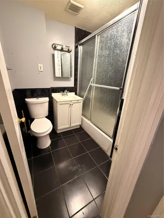 a bathroom with a toilet and a sink