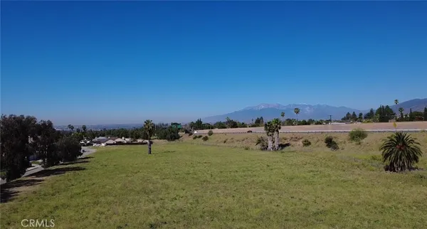 a view of a lake with houses in the back