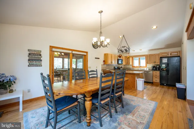 a living room with furniture fireplace and a table