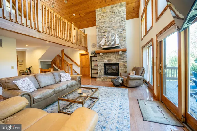a spacious bedroom with a bed and a chandelier