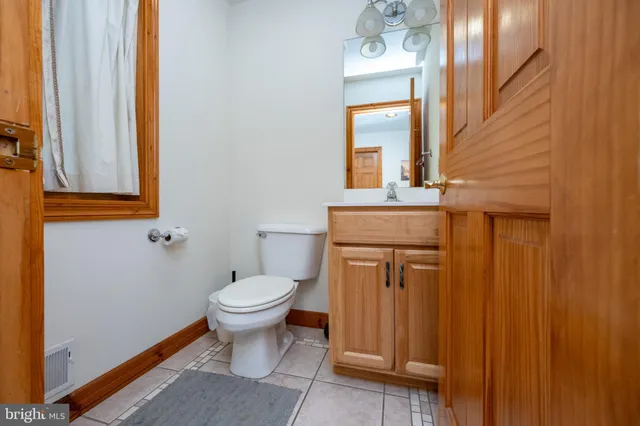 a bathroom with a bathtub and a toilet
