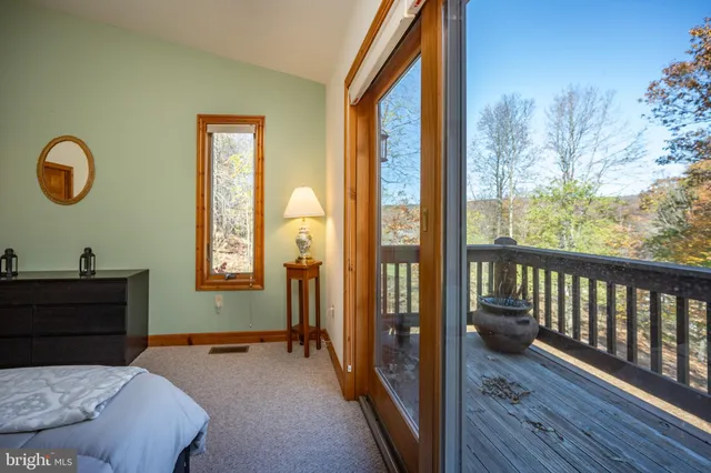 a view of a deck with furniture and wooden floor