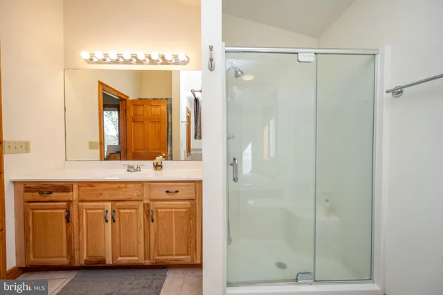 a living room with furniture pool table and a fireplace