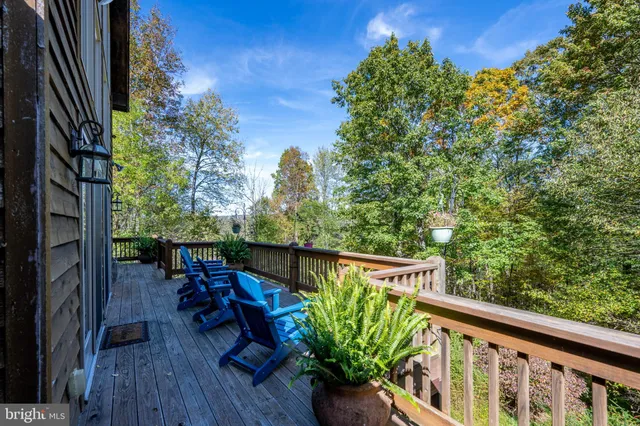 a bathroom with a sink a toilet and shower curtain
