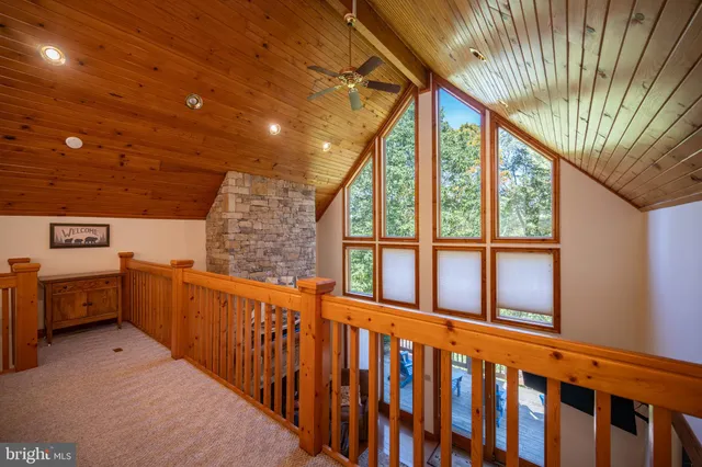a white toilet sitting next to a shower
