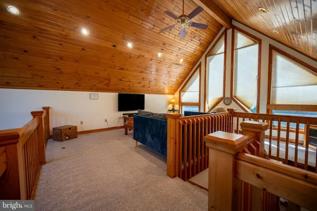 a view of balcony with wooden floor