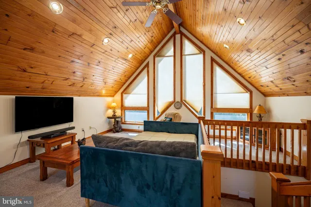 a aerial view of a house with swimming pool next to a yard