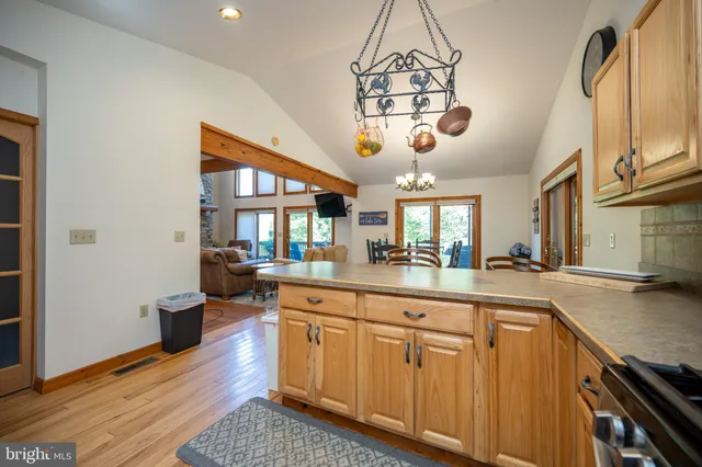 a living room with furniture fireplace and a large window