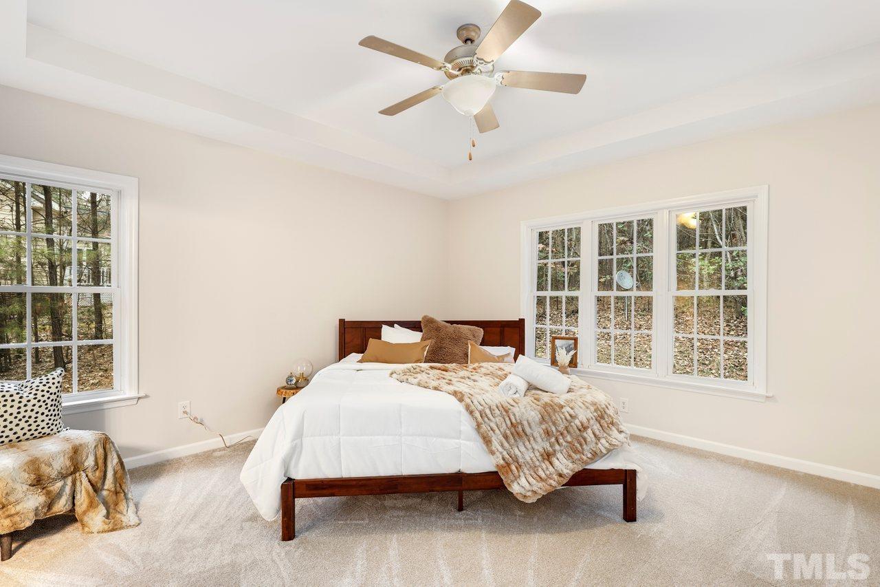 7015 Cedar Road Sanford, NC 27332 - Photo 11 of 30 a bedroom with bed and window