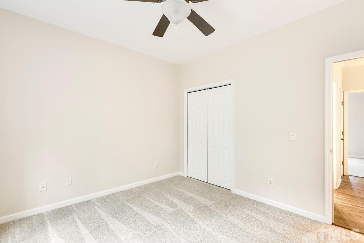 7015 Cedar Road Sanford, NC 27332 - Photo 19 of 30 a view of a room with a ceiling fan and a window