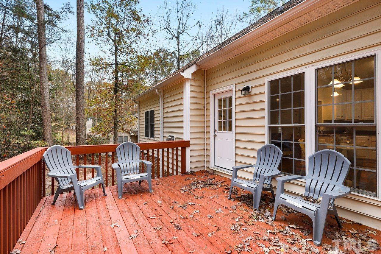 7015 Cedar Road Sanford, NC 27332 - Photo 23 of 30 a view of a chairs with a deck