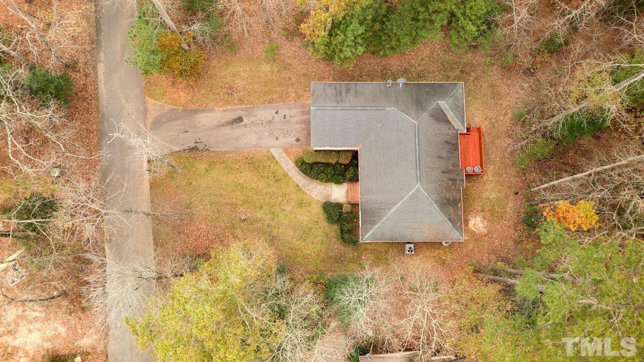7015 Cedar Road Sanford, NC 27332 - Photo 26 of 30 a aerial view of residential house with pool and yard