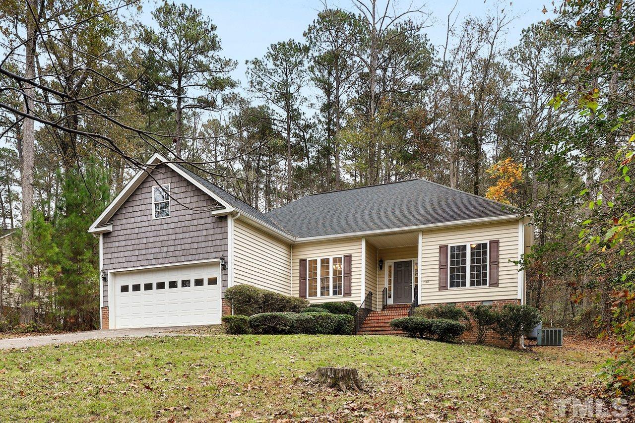7015 Cedar Road Sanford, NC 27332 - Photo 30 of 30 a front view of a house with a yard and garage