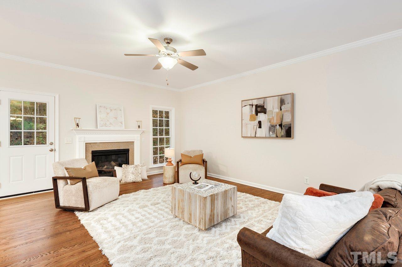 7015 Cedar Road Sanford, NC 27332 - Photo 3 of 30 a living room with furniture and a fireplace