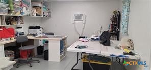 496 Romona Road Seadrift, TX 77983 - Photo 18 of 35 a view of a workspace with furniture