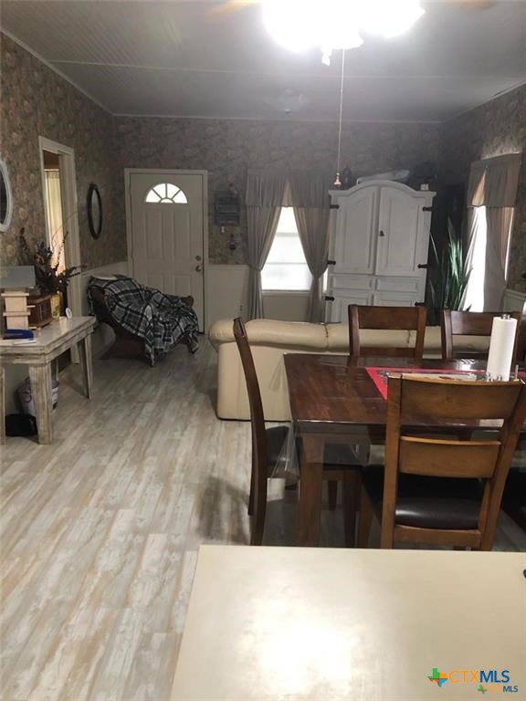 496 Romona Road Seadrift, TX 77983 - Photo 6 of 35 a living room with furniture a window and a table