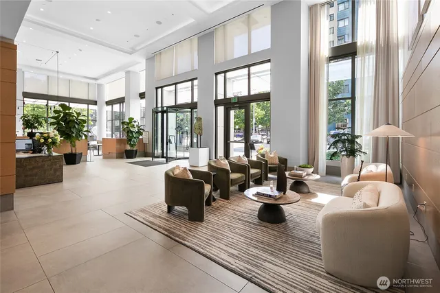 a living room with furniture and a potted plant