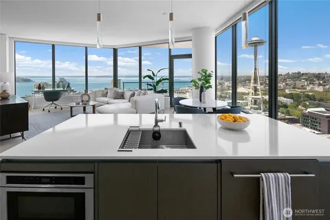 a view of living room with furniture and floor to ceiling windows