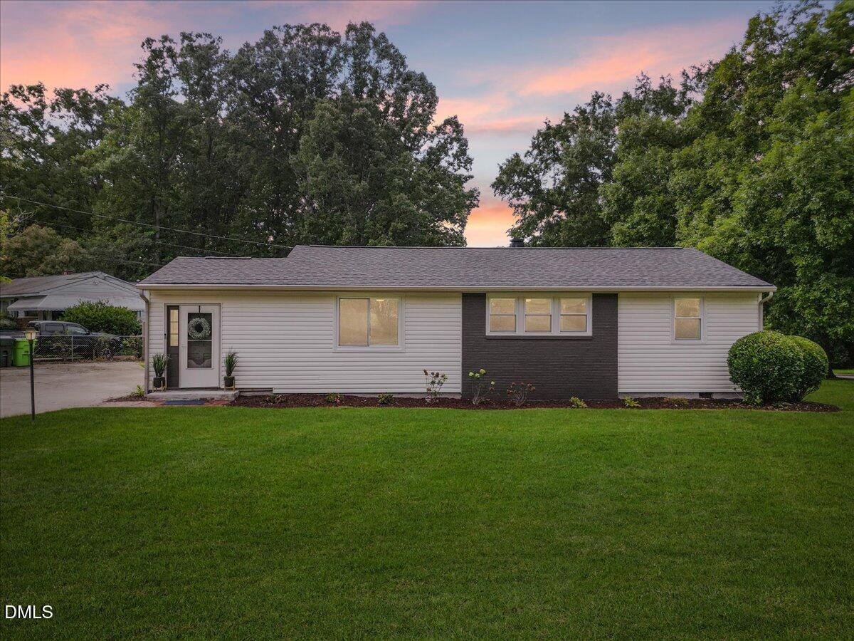 3437 Apache Drive Raleigh, NC 27609 - Photo 1 of 33 a front view of a house with a garden