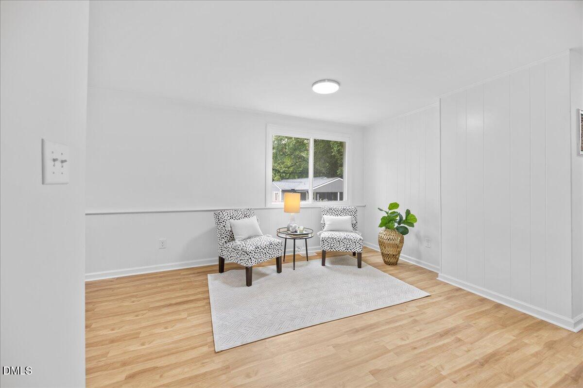 3437 Apache Drive Raleigh, NC 27609 - Photo 11 of 33 a living room with furniture and a potted plant