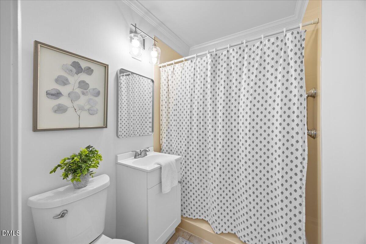 3437 Apache Drive Raleigh, NC 27609 - Photo 17 of 33 a bathroom with a shower curtain